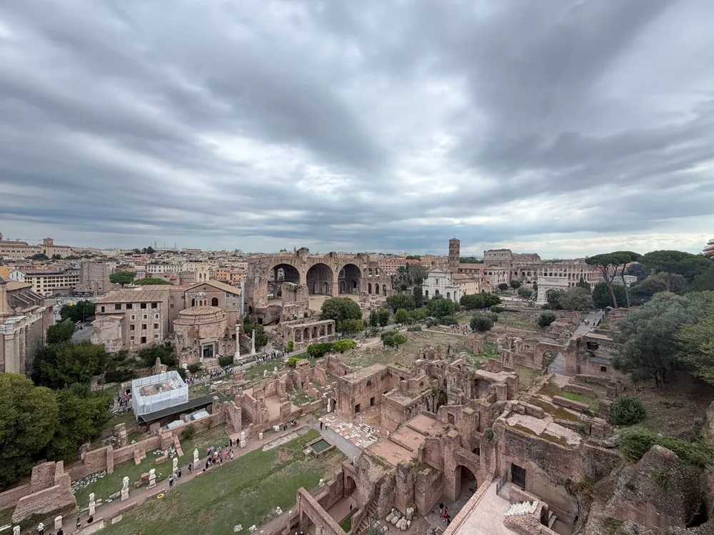 The Roman Forum seen from above under a grey cloudy sky