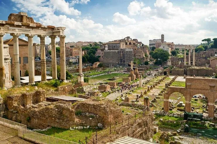The columns of the Temple of Saturn standing above the ruins of the Roman Forum